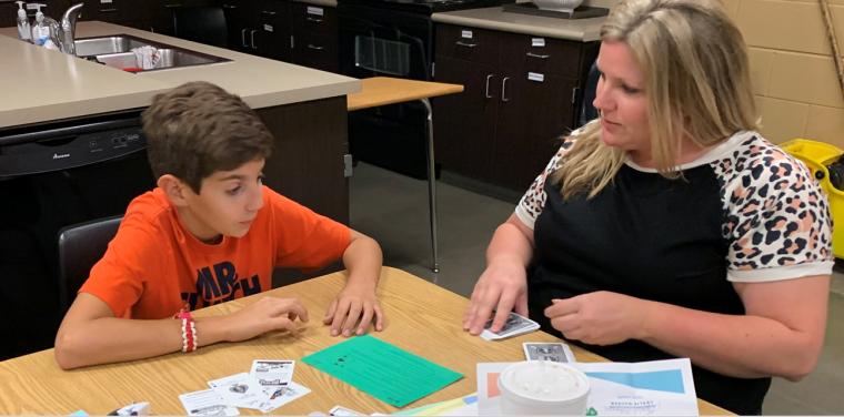 Sarah Garcia and her son Greyson participate in a Strengthening Families activity to improve communication.