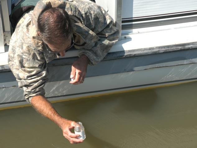 Greg Stoner, a state fisheries management biologist and advisor to the Lake of the Ozarks Watershed Alliance, collects a water sample from one of the lake's many coves.University of Missouri