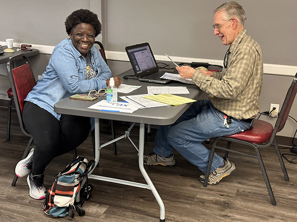 VITA volunteer tax preparer working with client