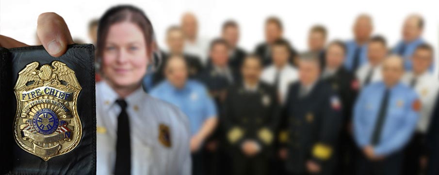 Woman holding a fire chief badge