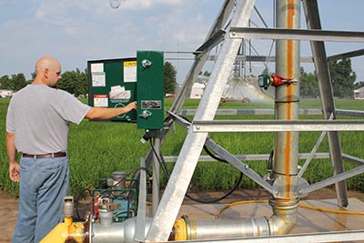 man managing irrigation equipment