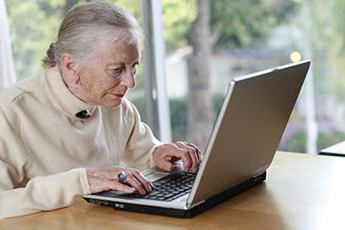 Senior working on a laptop computer