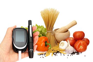 blood sugar level tester and vegetables and grains