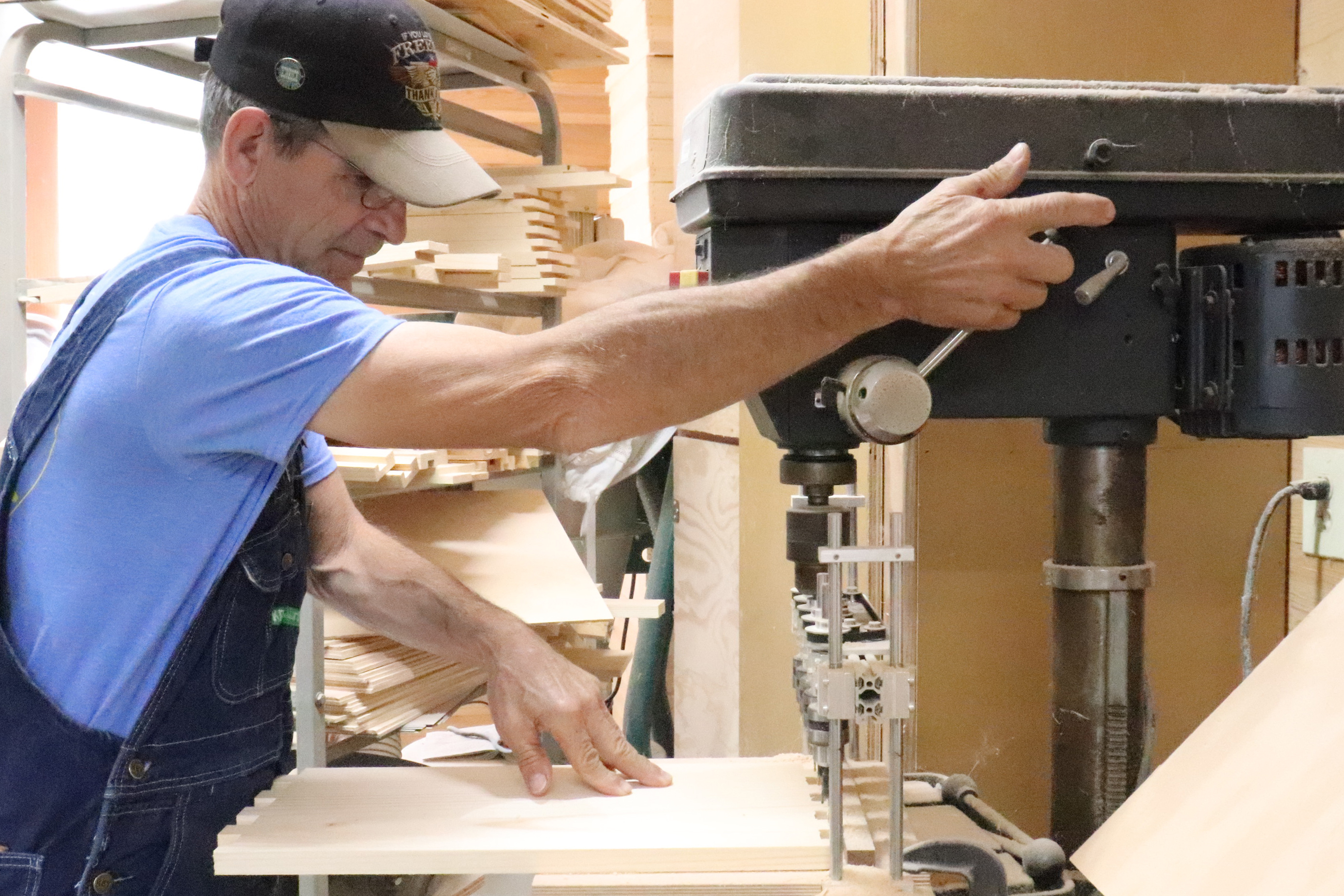 Heroes to Hives participant Larry Soles has a large, well-equipped wood shop where he makes beehive boxes and other beekeeping supplies. He sells the products to other veterans at low cost to make beekeeping more affordable. Photo by Linda Geist.