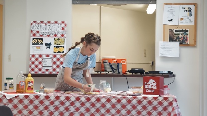 Eleanor Butler shares her recipe for smoked deviled eggs during the egg demonstration contest at State 4-H Poultry Day.