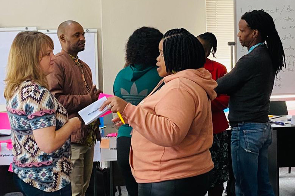 Sarah Hultine Massengale, left, engages with Neighborhood Leadership Academy participants. Funding for this project was provided by a grant through the University of Missouri South African Education Program. Photos courtesy of Sarah Hultine Massengale.