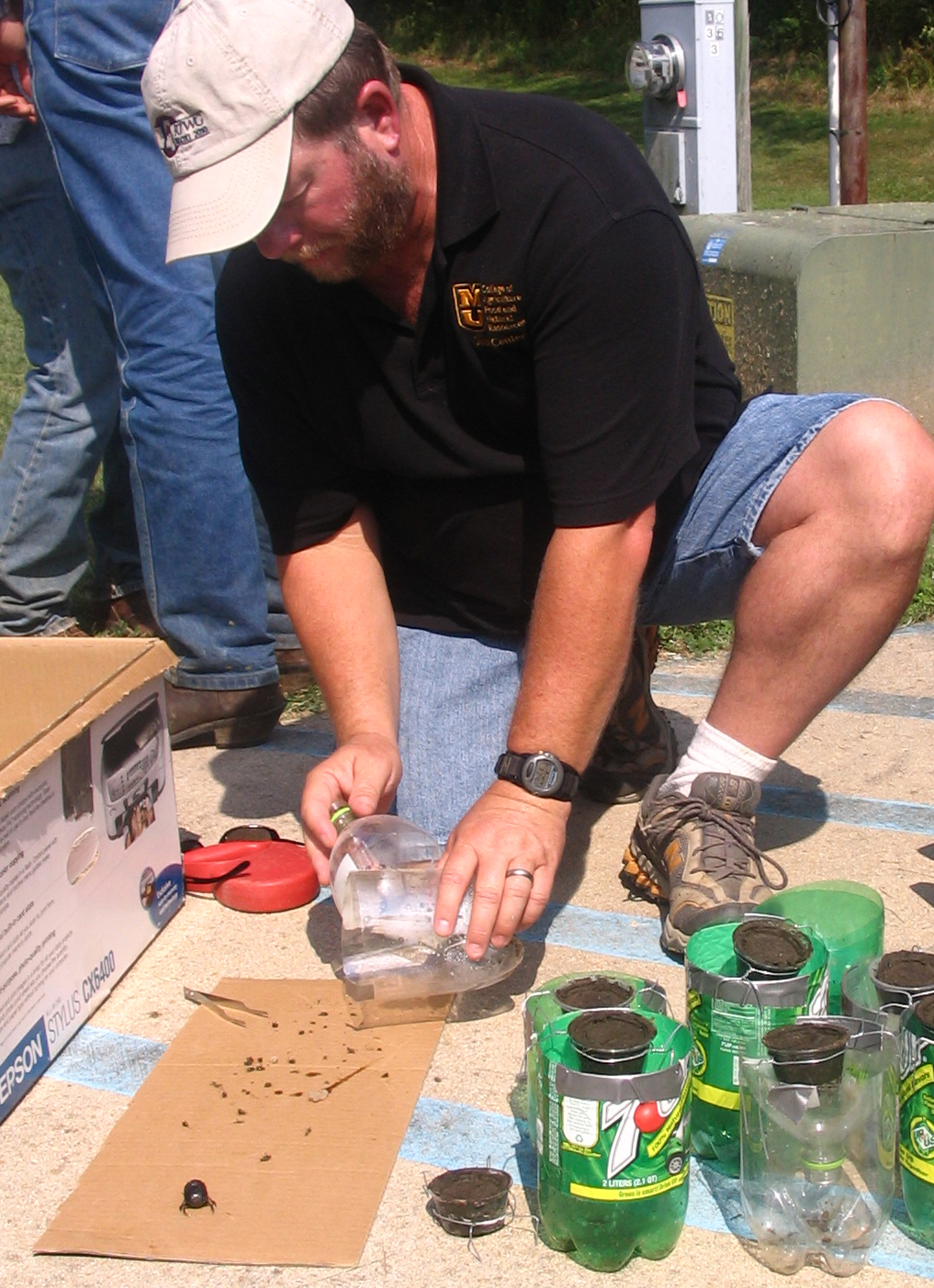 MU research associate Kent Fothergill examines dung beetle traps at Wurdack Farm.MU Cooperative Media Group 