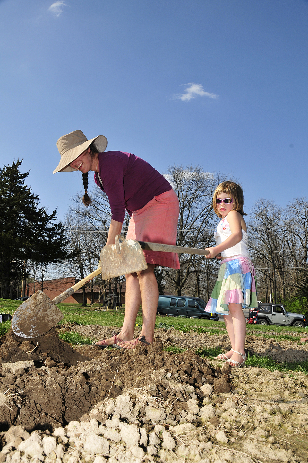 Sarah Linsenmeyer and daughter Pearl Zwingle work at Westwinds Court, a neighborhood garden in Columbia, Mo., in this 2009 file photo. 