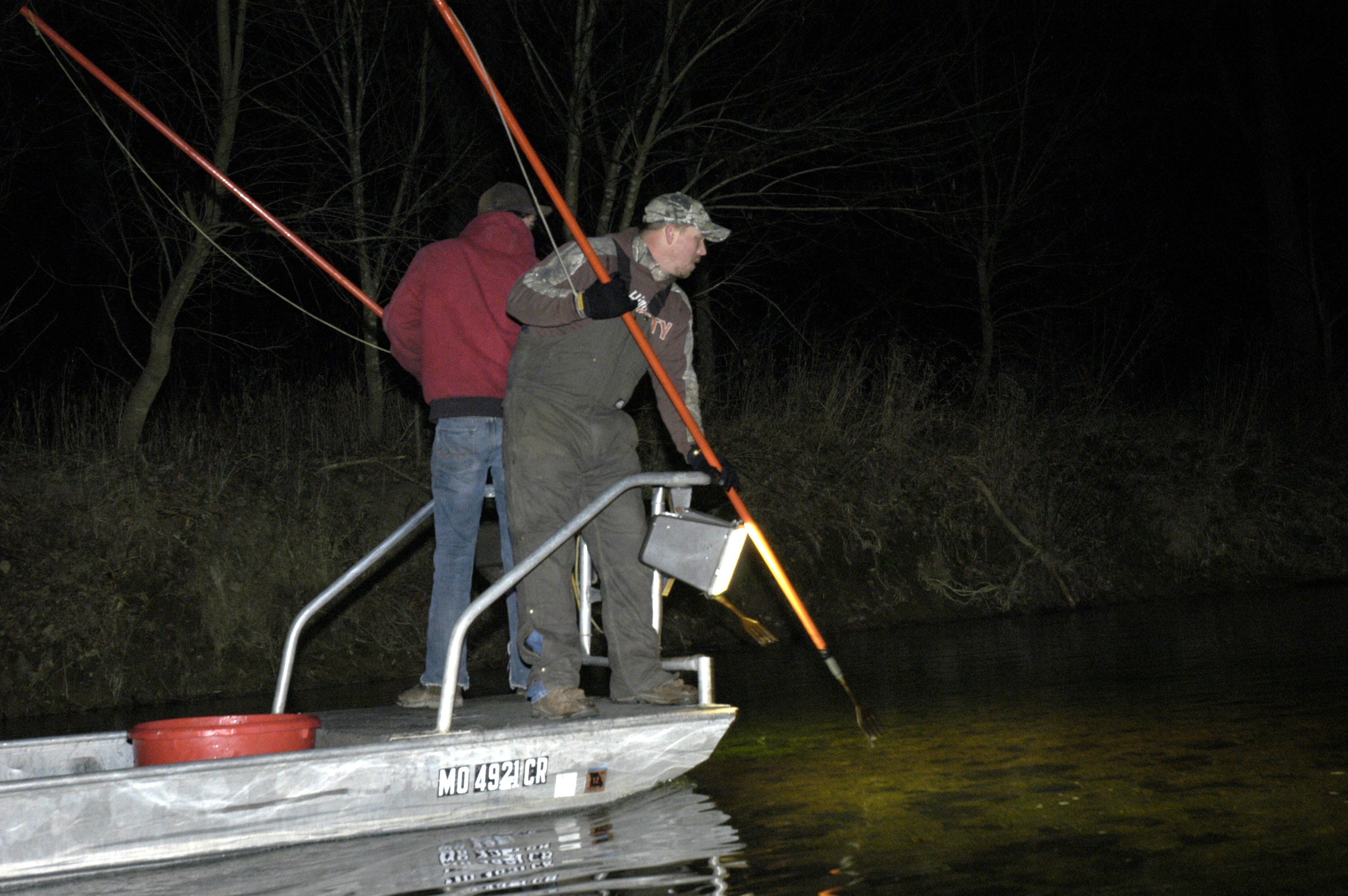 Andrew Stoops, left, and Steven Bird gig for sucker fish on the Current River in Shannon County, Mo.MU Cooperative Media Group 