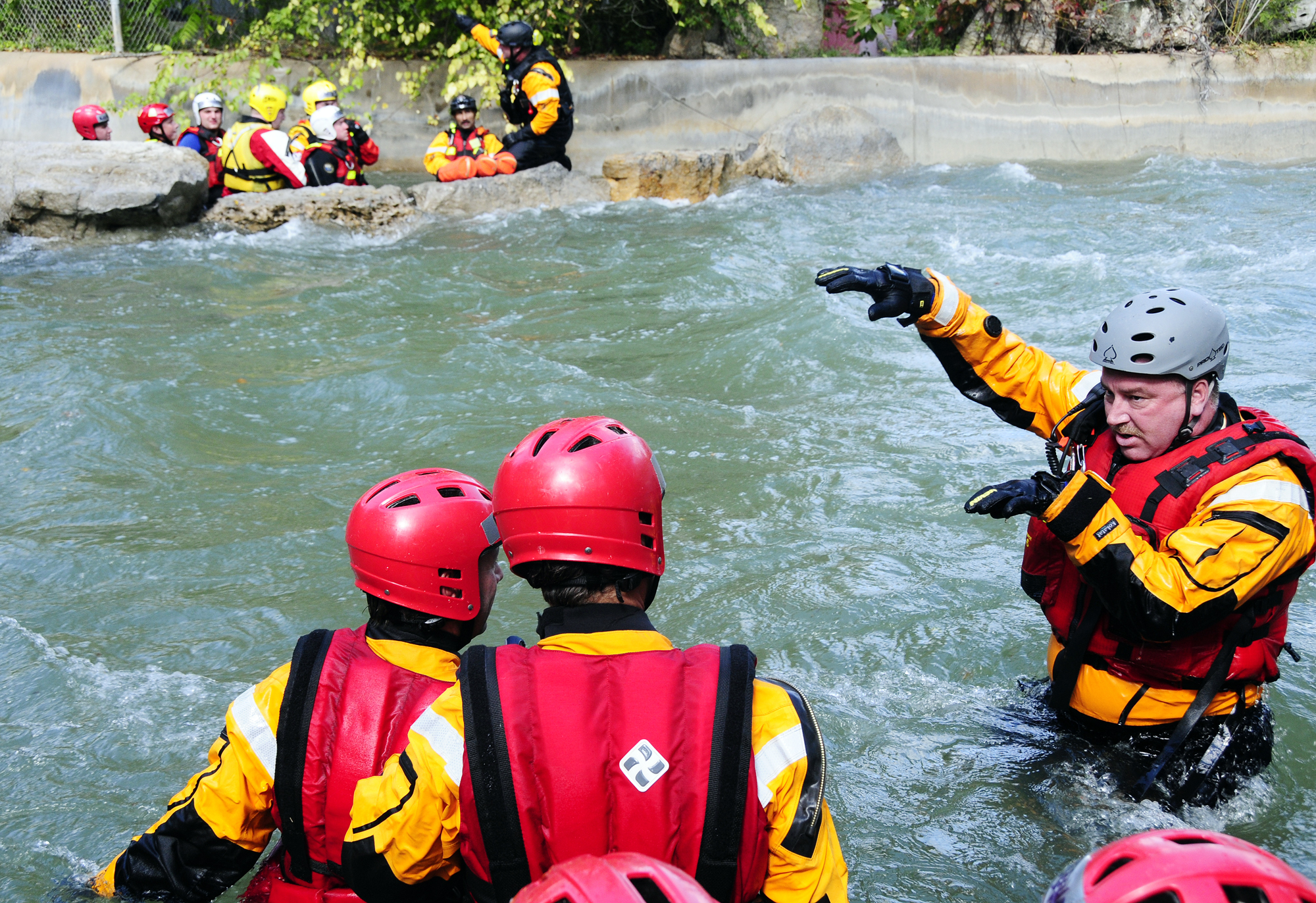 MU FRTI instructors explain swimming techniques to students during Swiftwater Rescue training at Six Flags St. Louis. Roger Meissen/MU Cooperative Media Group