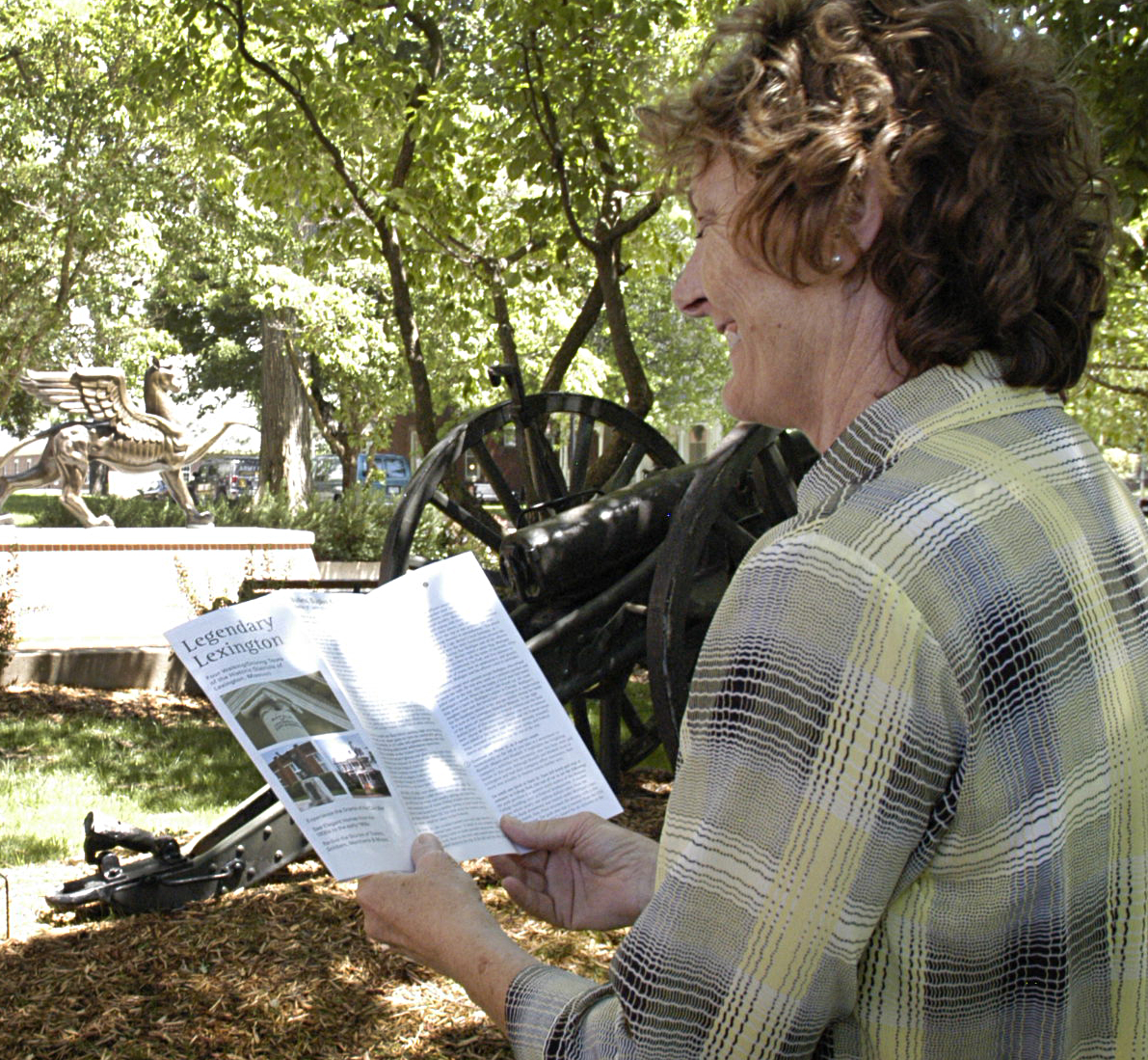 Marilynn King, graduate student in rural sociology at MU, checks out a map of the historic places in Lexington, Missouri. Volunteers with the Lexington Community Arts Pilot Project and MU faculty and students created a audio walking and driving tour to goMU Extension