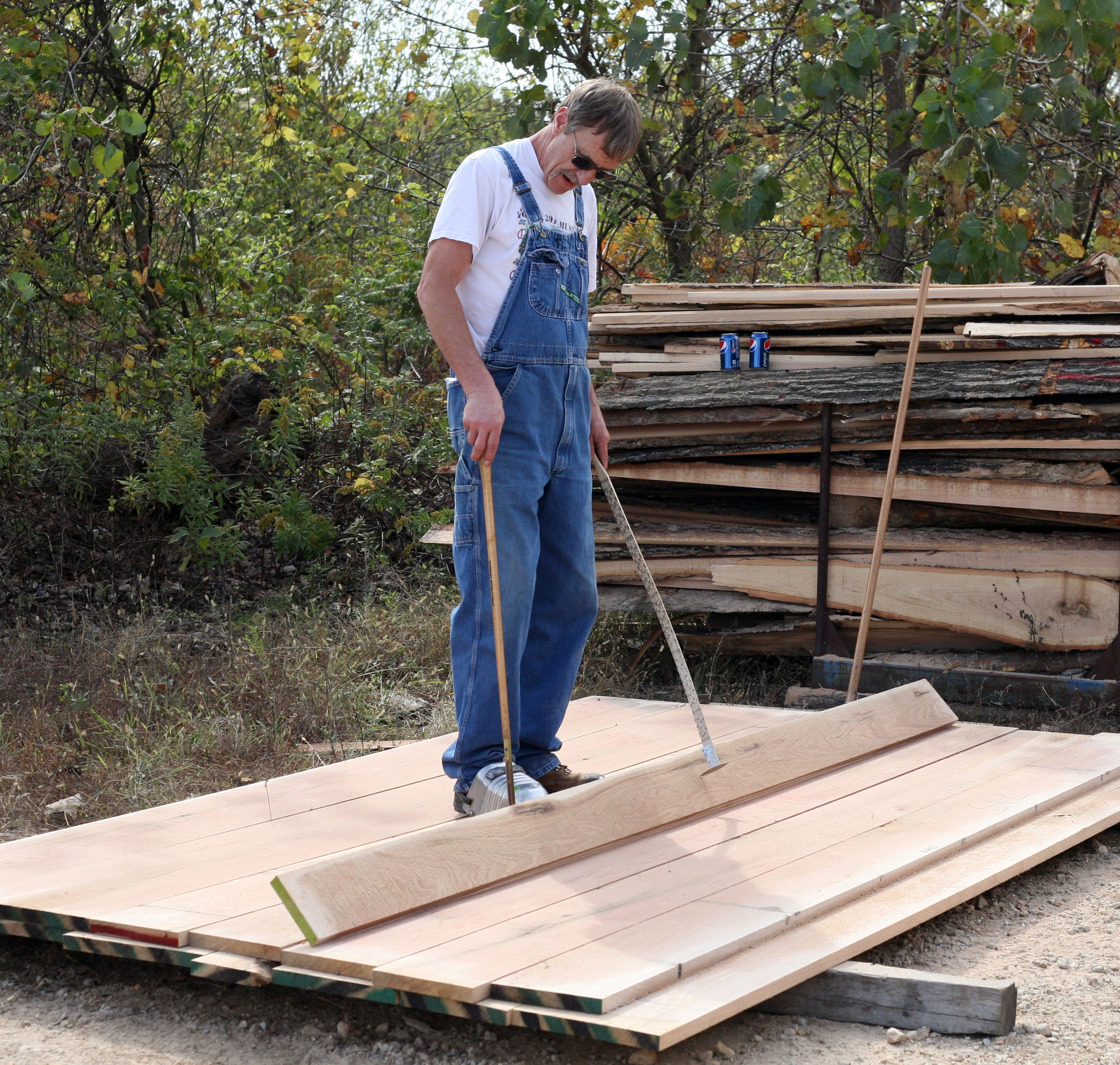 Frank Hook of Missouri-Pacific Lumber grades the boards milled in the study.University of Missouri